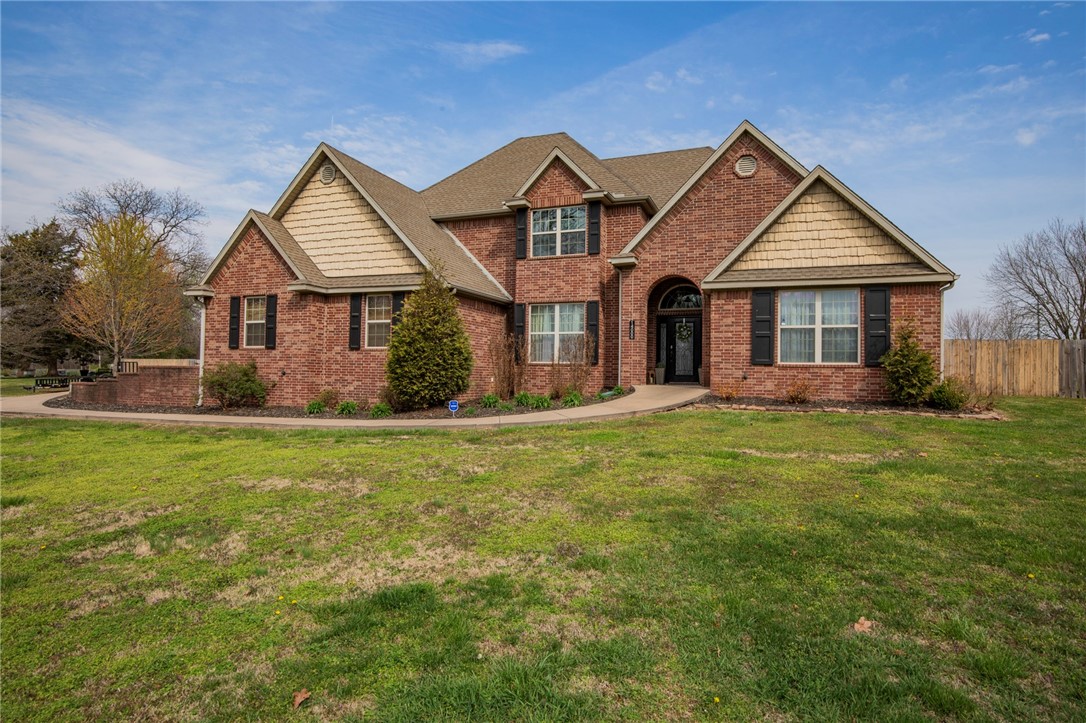 This is what everyone is looking for: location, land, and lifestyle! A timeless 4 bedroom, 3.5 bath, brick home on 2 beautiful acres with a 3 car garage in the highly desired Bentonville school district. This property is only 9 min from Bentonville West, 10 min to I49, & 20 short min from the hustle and bustle of DWTN Bentonville. This stunning property boasts a spacious heated/cooled shop perfect for all of your hobbies and projects and an above ground pool surrounded by a beautiful deck for those hot summer days. Enjoy the view of the lush .86 acre fenced backyard from the covered porch. The home features walk in closets in every bedroom, a spacious master suite, a large bonus/game room, and an updated kitchen with Bosch stainless steel appliances (warranty included). With it's serene surroundings and convenient location, this home offers the perfect blend of tranquility and accessibility. Don't miss out on this rare opportunity to own your slice of paradise.