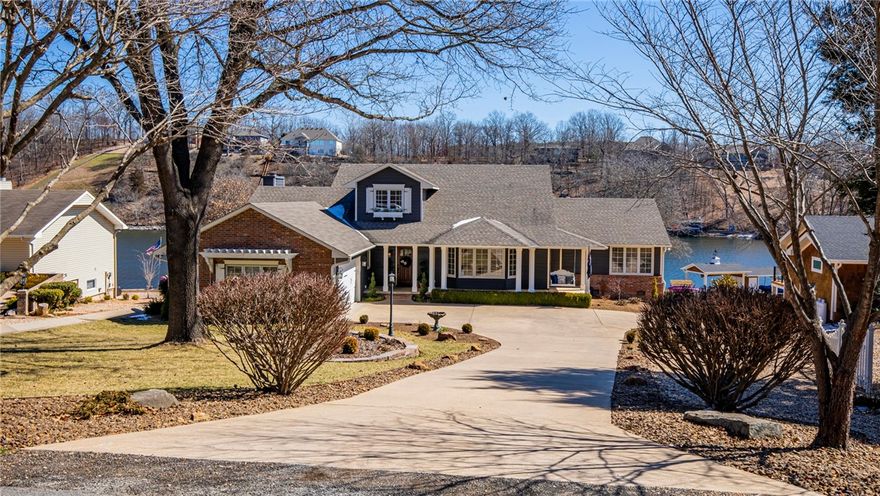 Rare Charm, Quality and Level to Lake with 106’ lake frontage! Location, quiet loop great for walking.  Remodeled in 2018 with current finishes, adding heated and cooled sunroom and opening up to the kitchen. New fans and light fixtures inside and out. New appliances including a gas range, sinks, faucets, granite tops and marble backsplash. Baths updated with granite and marble. New sinks, faucets, tub, and showers. Two family rooms both with gas fireplaces leading to the sunroom and dining room. Amazing sunrises and cool afternoons inside and lakeside afforded by SE exposure. Quality built by O.A.K. with geothermal, 6" exterior walls, solid wood doors interior and exterior, lifetime cedar siding, Pella wood windows and doors, hardwood throughout. BR suite with patio doors to deck. Basement partially finished rec space can be finished out as an apartment. Covered boat dock w/ pavilion, electric boat lift and composite decking. New extensive landscaping. 3 Bed 3 Bath & Study/Office w/closet. Furniture negotiable