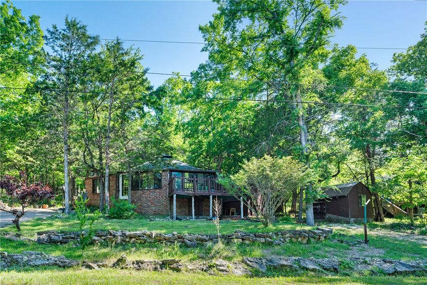 Welcome to 9 Starlite Avenue in the heart of Eureka Springs, a charming retreat nestled in one of Arkansas’s most beloved historic and scenic destinations. This inviting property offers a peaceful setting surrounded by the natural beauty and unique character that make Eureka Springs so special. Inside, you’ll find a comfortable layout designed for everyday living with warm, welcoming spaces and great natural light throughout. The home blends functionality with charm, offering a relaxed atmosphere ideal for full-time living, a weekend getaway, or a potential investment opportunity. Step outside to enjoy the tranquil surroundings, where mature trees and the quiet neighborhood setting create a sense of privacy and escape. Whether you’re sipping morning coffee on the porch or winding down after a day exploring downtown Eureka Springs, this property delivers a true Ozarks lifestyle experience.