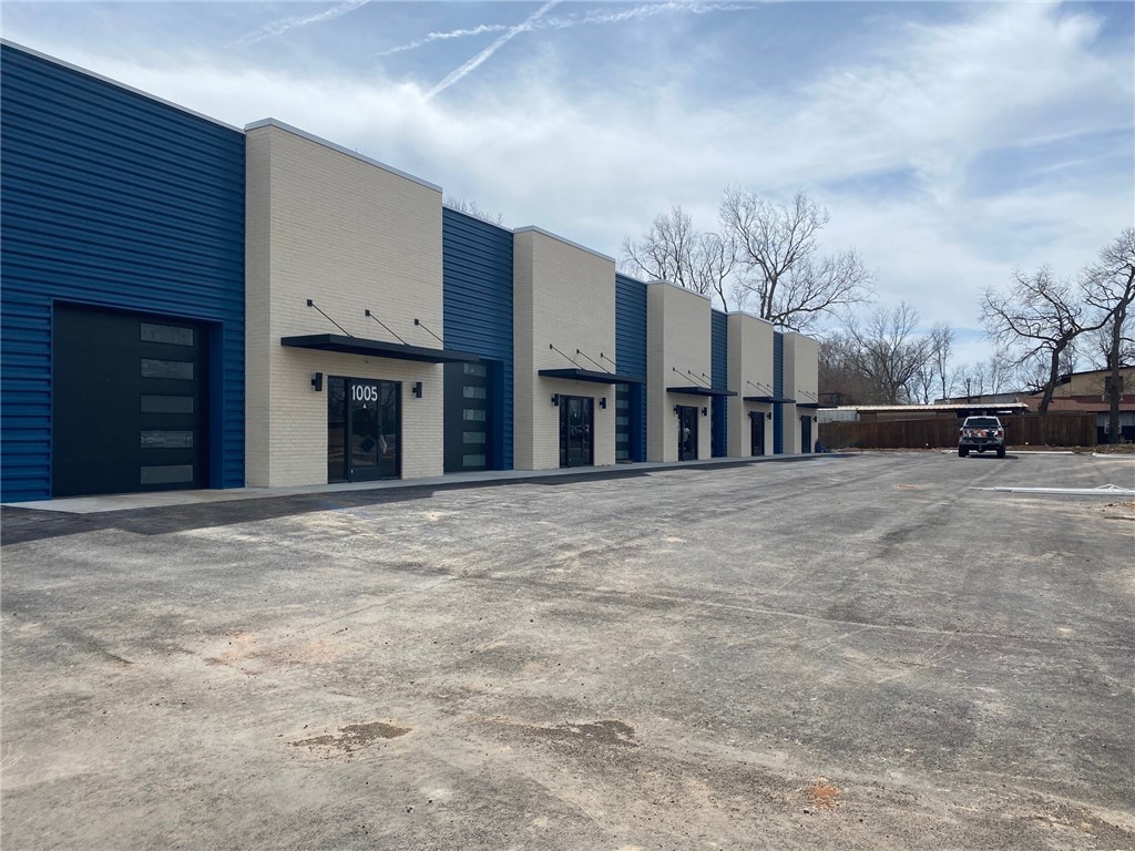 For Lease 10,550 SF or smaller sections. This building has 5 sections with 12' rollup doors. One section has two 12' rollup doors. Each section is 30' wide by 70' deep. You can lease to suit for what you need to open your business. Could be tire shop, flooring store, gym, small store, coffee shop, beer pub - endless possibilities. Road frontage.