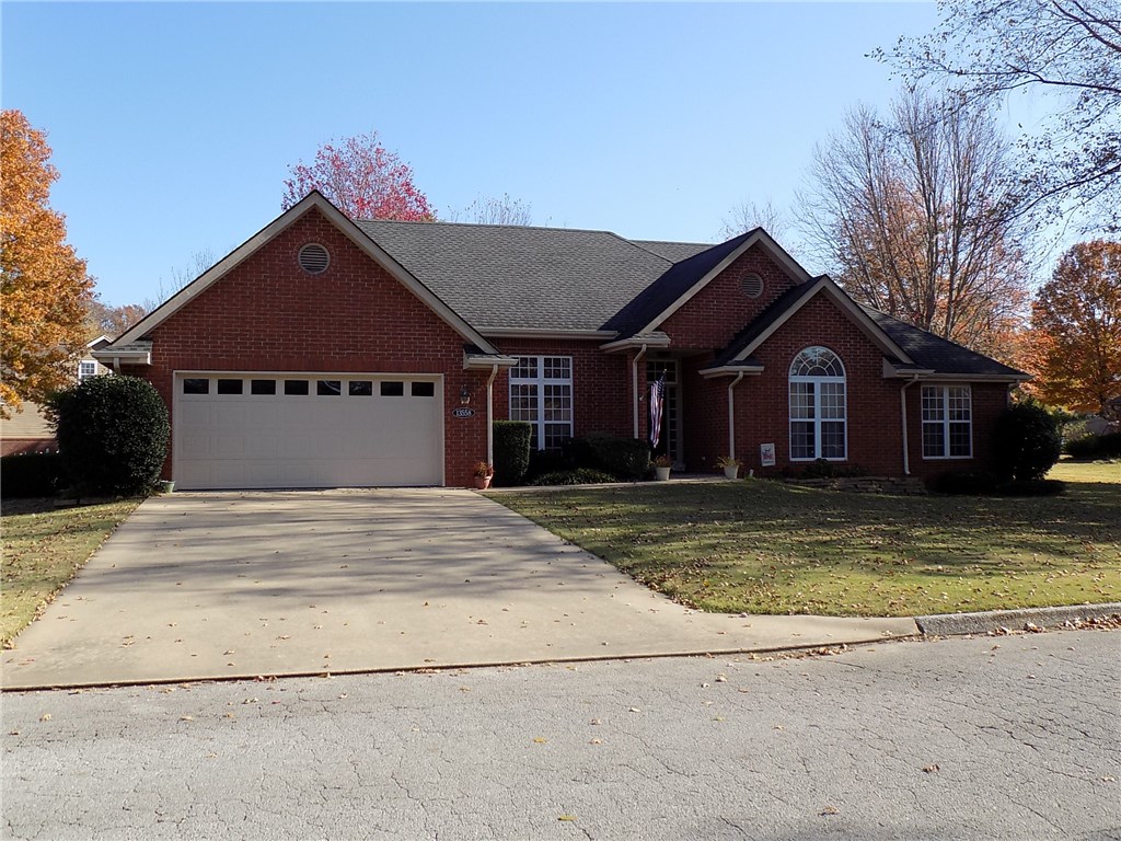 Very nice well maintained all brick home. Wood flooring in entry, halls and formal dining room. Open living area to kitchen, gas log fireplace in living room. Formal dining with decorative ceiling. Enjoy all the natural light! Large kitchen with newer granite counters and back splash. Kitchen appliances are updated 5 burner gas cook top, refrigerator conveys. Under cabinet lighting, lots of cupboards. Large bedrooms, master bath has newer quartz counters, double vanities jetted tub and separate shower. The heat and air system is newer. Large utility room with built-ins and sink. The 2 car garage is over sized with separate area for workshop and has it's own garage door that opens to the back yard. Lovely landscaped yard with mature trees.