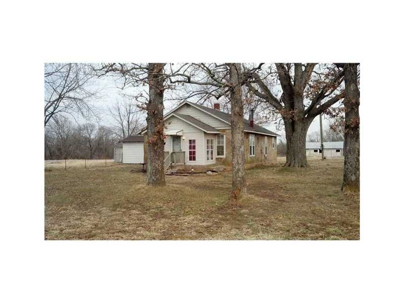 Perfect spot for your small commercial venture, storage buildings, shop, etc...Not yet zoned within the county for commercial,Small house and barn on property rent at 500 per month