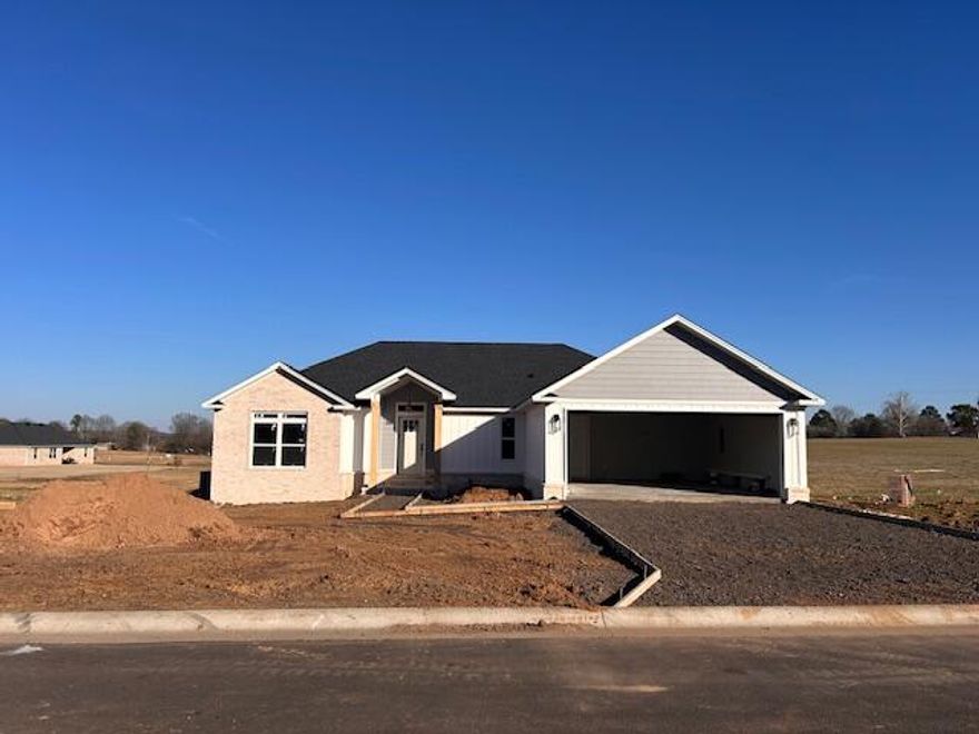 MOVE-IN READY! efficiency and design in mind in this new 3 BR, 2 BA brick home with hardwood flooring, ceramic tile and quartz countertops in kitchen and bathrooms.  Just over 1600 sq. ft., this split floor plan features a master suite with a well-designed master bath--whirlpool tub, walk-in shower, separate toilet, large walk-in closet and a linen closet!