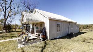 Looking for a cute little starter home between Harrison and Branson? Well here you go, this cute little farm house is conveniently located about 6/10ths of a mile off of Hwy 65 just south of Burlington. Has had some updating, including a kitchen makeover. Home features a metal roof, central heat and air, and a beautiful view...Check it out!!