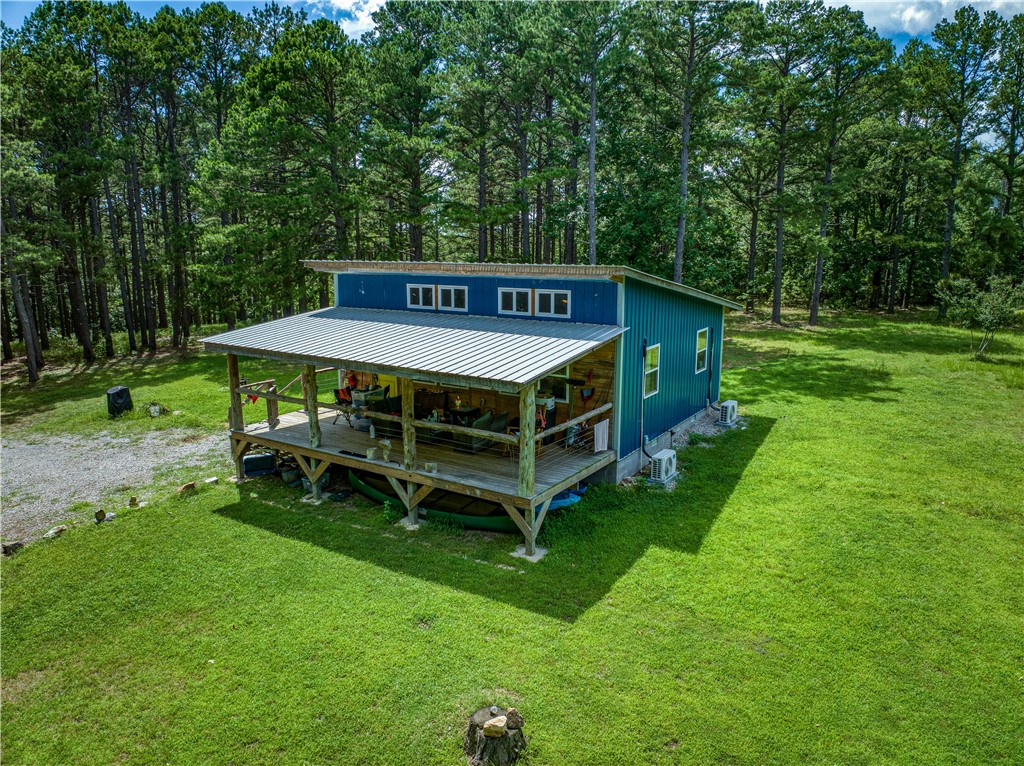 Tucked away in the heart of the Ozarks, 190 MC 6041 offers a peaceful escape surrounded by nature. This private retreat sits on a quiet, wooded lot with mature trees, abundant wildlife, and the soothing sounds of the forest. Step outside to enjoy the fresh mountain air, star-filled skies, and quiet mornings filled with birdsong. The land rolls gently with natural beauty in every direction, ideal for exploring, relaxing, or simply unwinding in peace. Whether you're watching deer pass through the trees or enjoying a quiet sunset from the porch, this property invites you to slow down and reconnect with the land. Just a short drive from the Buffalo National River and countless outdoor adventures, this is your chance to own a slice of unspoiled Arkansas wilderness.