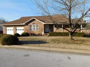Spacious Home, All Brick, Convenient Location, features include hardwood flooring and vaulted ceiling in living-dining area, built in oak china cabinet, built in oak desk off family area, spacious living and dining areas on main floor and in basement, gas fireplace, jetted tub, covered rear deck with steel railing and stairway, patio off lower level with fenced courtyard, fenced back yard, Must Se