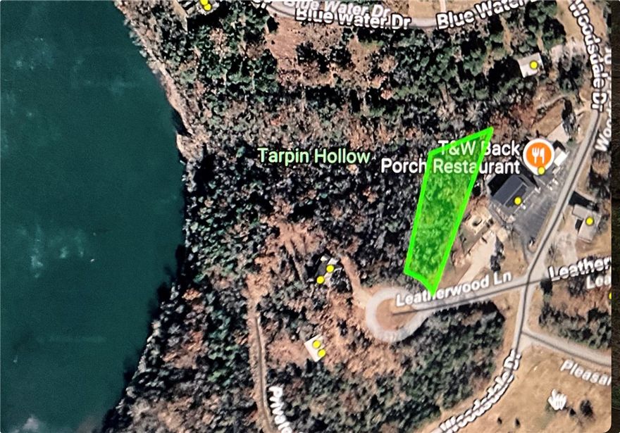Where the Pavement Ends and the Lake Begins! At the Mouth of TableRock lake and foothills of the NWA Ozarks, this Trailside/lakeside lot is impressive! Holiday Island is a Lake Community with a full-service Marina, now-wake Kayak & Paddle Board Cove, 2 Swimming Pools, Pickle Ball, 2 Golf Courses (9 hole and 18 hole), Tennis Courts, Community Garden, Butterfly Pavilion, Community Center, all in Eureka Springs Schools. Historic Eureka Springs is only 4 miles away! A 37 Beautiful mile commute to Rogers! Enjoy the Best of the Ozarks in AR's Newest City, Holiday Island! Breathtaking views throughout this community; Swimming Holes, Bald Eagles, Cliff Views over the Lake & Views of the Boston Mountains in MO! WalMart deliveries, Grocery Store in town, cafes, cantina, and Holiday Island Grill, get ALL of the access w/o the traffic! Table Rock Lake is a vast 43,000+ acre (surface area) lake that winds through Missouri & NWA.  Lot comes with house plans shown in photo.  Bring your own Builder or select from our local pool.