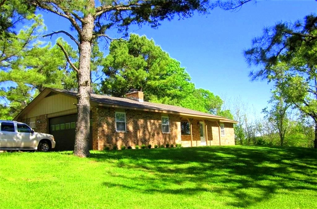 This beautifully updated home sits on a rolling 21+ AC with amazing views. Approx. 3/4 in pasture and balance is wooded with many mature trees. The spring fed pond makes this property perfect for livestock. A 20X30 metal workshop needs a little TLC but has 50 amp elec. Roof, chimney & windows replaced in 2015 & interior was completely updated in 2016 including new kitchen, bathroom, FP covering, flooring, woodwork & doors. This shows very well and has motivated sellers!