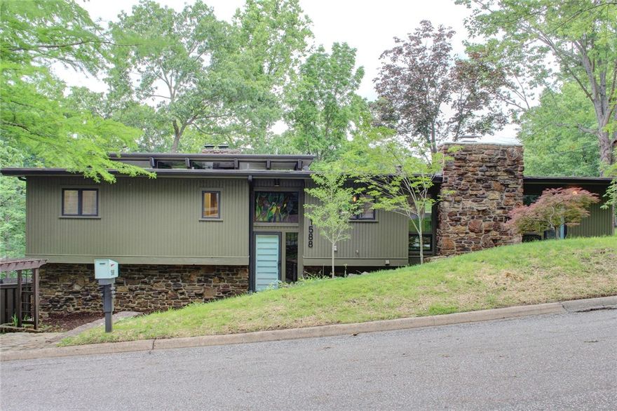 Beautifully renovated mid-century modern home by Mark Zweig, on a spacious, landscaped and treed corner lot. This stunning 4-bedroom residence features three natural stone wood-burning fireplaces and multiple living areas filled with natural light. Enjoy outdoor living with multiple decks and a large stone patio, perfect for entertaining or relaxing. Inside, the home boasts all new paint, newly refinished or new flooring, and updated lighting and plumbing fixtures throughout. The modernized kitchen and bathrooms blend timeless design with fresh, functional upgrades. Appliances including refrigerator, washer, dryer, whole-house generator all convey. This unique home offers a rare combination of architectural style, thoughtful updates, and indoor/outdoor living. Situated on a quiet corner lot with mature trees and abundant charm, this home is a true gem with room to live, work, and unwind. A perfect blend of mid-century elegance and today’s comfort awaits you! Back on market at no fault of house or Seller.
