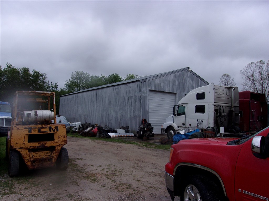 Big 3200 sqft Mechanic shop with 768 sqft outbuilding with 3 bedroom 2 full bath house to use for new owner to live in or use as office space. This property sits on 5.13 acres.