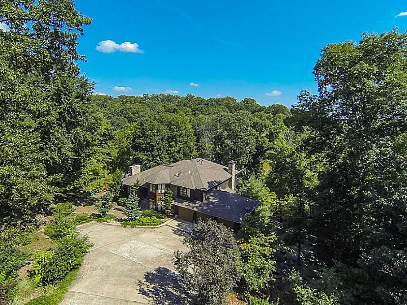 GORGEOUS EXECUTIVE HOME ON PRIVATE LANDSCAPED ACRE. MINUTES FROM I540 AND MUSEUMS. ENJOY THE NATURAL STATE FROM THE LARGE WRAP AROUND DECKS, OUTDOOR FIRE PIT AND TERRACED PLAYGROUND. LARGE UPDATED FLOORPLAN FULL OF NATURAL LIGHT, REAL HARDWOODS, 2,FIREPLACES. SPECIAL FINANCING AVAILABLE THROUGH SIRVA MORTGAGE. Seller to pay up to $3500 in buyers closing costs