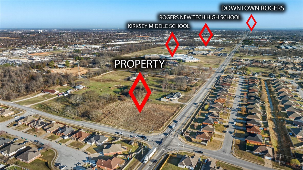 An incredible investment opportunity near the vibrant heart of Downtown Rogers! This prime 2.32 -acre commercial lot is perfectly positioned amidst thriving neighborhoods, flourishing businesses, and top-rated schools, making it an ideal location for your next venture. Imagine the possibilities—whether it's a high-traffic convenience store, a modern strip mall, or a dynamic mixed-use development catering to the growing community. With T5.1 commercial zoning already in place, the groundwork is set for success. Architect and engineering plans are available for purchase, streamlining your path from vision to reality. Don't miss the chance to bring your business dreams to life in this rapidly expanding area.