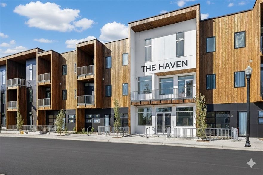 Perched atop THE HAVEN, a boutique 29-residence building, this luxury corner penthouse offers rare privacy, iconic views, and elevated design. Enjoy secured entry, elevator access, and a private two-car garage. Floor-to-ceiling windows frame views of the new Walmart Home Office campus and the Momentary’s video wall, while two expansive private balconies extend the living space outdoors. Inside, 12’ ceilings, a central fireplace, and 10” wide-plank hardwood floors create a refined, light-filled atmosphere. The kitchen is a true showpiece with custom solid oak cabinetry in a warm walnut stain, cabinet-paneled built-in refrigerator and dishwasher, Bosch appliances including an induction cooktop and wall oven/microwave combo, and a quartz waterfall island with a bold lip and seamless quartz backsplash. The serene primary suite features balcony access, a large walk-in closet with built-ins, and a spa-inspired bath with double vanities, quartz apron sink, oversized shower with BRIZO rain head and handheld wand.