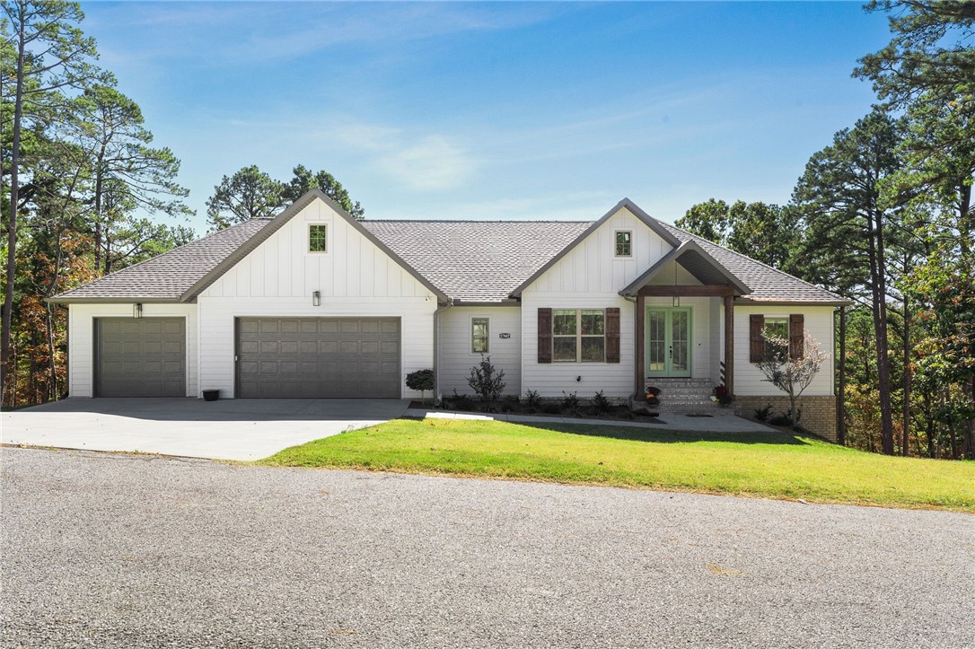 Fall in love with this exquisite four bed, two bath home nestled just minutes from Beaver Lake & only 10 minutes to Prairie Creek Marina! Offering the perfect blend of comfort and style from the moment you step inside! Greeted by an expansive open floor plan with vaulted ceilings, creating a bright and airy atmosphere for entertaining. The split floorplan ensures privacy, with large bedrooms designed for relaxation and a master suite that serves as a private retreat. The kitchen is a chef's dream, featuring granite countertops, ample counter space, high end appliances, and a huge walk-in pantry. Step outside to your beautifully landscaped backyard, where a personal putting green awaits, offering a fun and unique space for recreation. The spacious three-car garage provides plenty of room for vehicles, a boat, additional storage, or even a workshop! This home is designed for those who value both luxury & practicality with modern comforts in a beautiful, peaceful setting!