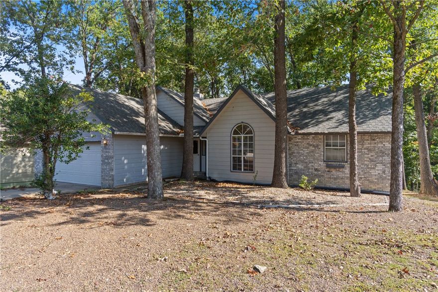 Nestled in an established neighborhood, this well-maintained 2-bedroom, 2-bath home offers 1,504 sq ft of comfortable living space on a gently sloping .36-acre lot. Built in 1990, the home features a versatile third room—perfect for a home office, den, or guest space—plus a spacious 2-car garage for added convenience. Enjoy the tranquility of mature surroundings while still being close to local amenities. Whether you're starting out, downsizing, or investing, this property blends functionality, charm, and location.