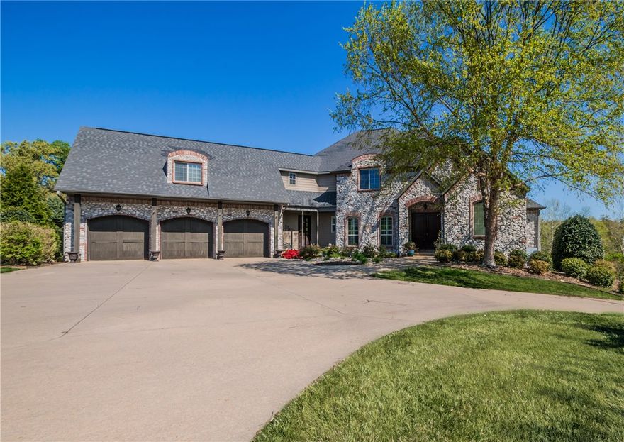 Escape to your own oasis at this beautiful 5 bedroom home nestled on secluded 2.92 acre property with private heated pool!  An entertainer's dream offering an open floor plan and multiple decks with wonderful views of the wooded backdrop. Designer touches and amenities are abound including wood floors, cathedral ceilings, walk in closets, gourmet kitchen and 5 car garage.  Full walk out basement with home theater, 2nd kitchen, exercise room, study and game room!  NEW ROOF August 2020!