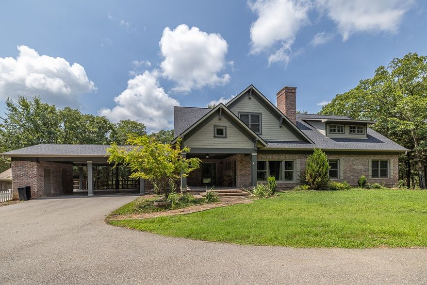 Privacy and relaxation await at this beautiful home on over 8 acres just 10 minutes from all downtown Fayetteville has to offer! The downstairs boasts an open kitchen that flows into the living room or large formal dining area perfect for guests and dinner events. The doors right off the Kitchen leads you to the back patio to a retreat like atmosphere with a curtain of trees surrounding it that allows plenty of privacy to enjoy it privately, and can easily access the beautiful pool from this area. The upstairs of the home is where the main bedroom is and allows for easy access to the other upstairs bedrooms for convienence. The detached garage allows for space to do projects and have additional storage as well as an upstairs apartment, great for guests or just private space for watching the game. With a gated driveway and a short drive through the trees, you can be 'one with nature' in this picturesque Fayetteville home! Chicken coop does not convey! Schedule your showing today!