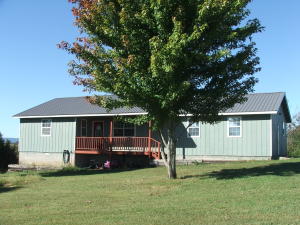 Pretty 3 o4 bedroom home with outstanding Ozarks View! Large living room, large kitchen/dining combination and large den or 4th BR. Covered porch. Deck. Pretty country setting. Several newer updates. Must See! All #'s approx.
