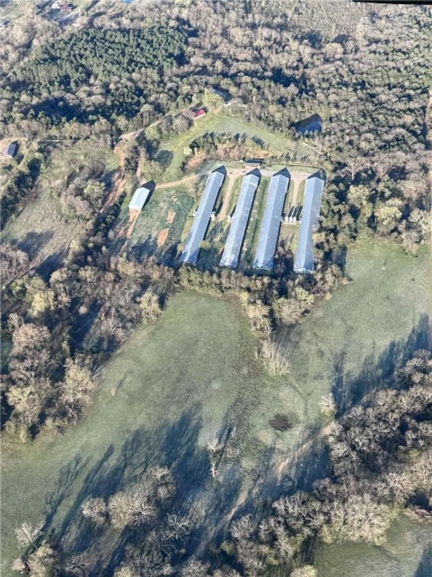 *Please do not drive out to property and look around. This farm does not allow visitors at this time. *Poultry Farm for Sale - Turnkey Opportunity Near Mt. Magazine! This 39.30-acre m/l property features a profitable poultry operation with a Tyson Foods contract and everything you need to step right in. Located in the scenic foothills near Mt. Magazine, this farm combines a thriving business with a peaceful rural lifestyle.
Farm Details 4 Broiler Houses:2 houses: 43 x 500 ft 2 houses: 50 x 500 ft Backup generator. Averages 7 batches per year with consistent income. Structures: Compost shed: 50 x 16 ft new litter shed: 40 x 104 ft Home Spacious 3-bedroom, 2-bath home with a 2-car garage. Perfect for a family looking to live and work on the property.