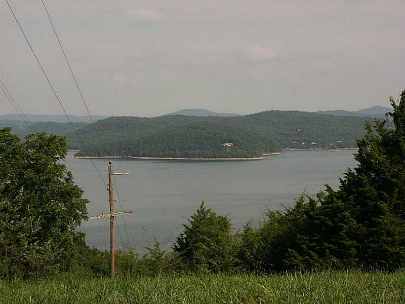 This three acre tract would be a great place to build a permanent or vacation home. Build close to the front of the lot for a possible lake view across the road or build deep inside the lot for maximum privacy! This lot is only 2 miles from Starkey Marina
