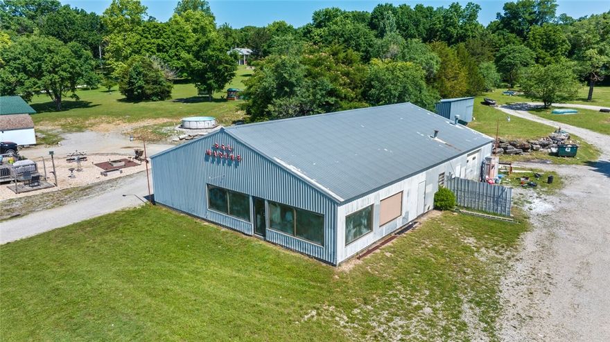 Prime Investment on HWY Frontage in One of the State’s Most Scenic Areas! Surrounded by stunning natural beauty—rivers, lakes, and attractions—this unique property offers immediate income and incredible potential. Nearby waterways include Kings River, White River, and Beaver Creek. Prefer lakes? Beaver Lake and Table Rock Lake are both within 25 miles. Just minutes from vibrant Downtown Eureka Springs! Property includes 3 duplexes, 1 cabin, 1 mobile home, and a main house with potential to convert to a duplex. Also features a 3,500 sqft commercial shop building, formerly used for boat sales and repairs. The insulated shop includes a garage service area, showroom, workbenches, and an overhead lift—ideal for many commercial uses. Already income-producing, this is a rare opportunity to invest in a prime location with room for growth. Main home and shop available to view now! Do not disturb tenants. Rentals viewable after executed contract. 3,500sqft shop not included in listing sqft. Appointment ONLY! Sold AS-IS!