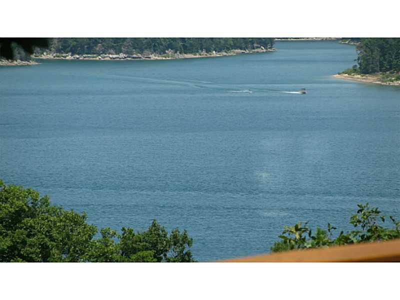 Year round lake view, recently updated, new hand scraped hickory planked floors, 900 sf deck, 2 mastersuites with granite. One with jetted tub and garden window, walk in shower w/dbl sinks and attached to office. 2nd master has separate entrance. Granite,Counter, new cabinets, recessed lighting, Lg Laundry w/sink, 14x36 workshop with half bath & storage , open floor plan, 2011 roof, abundance of closets & storge, private .74 acres only 10 minutes to Downtown Rogers. RV parking, new 4.5 ton HVAC