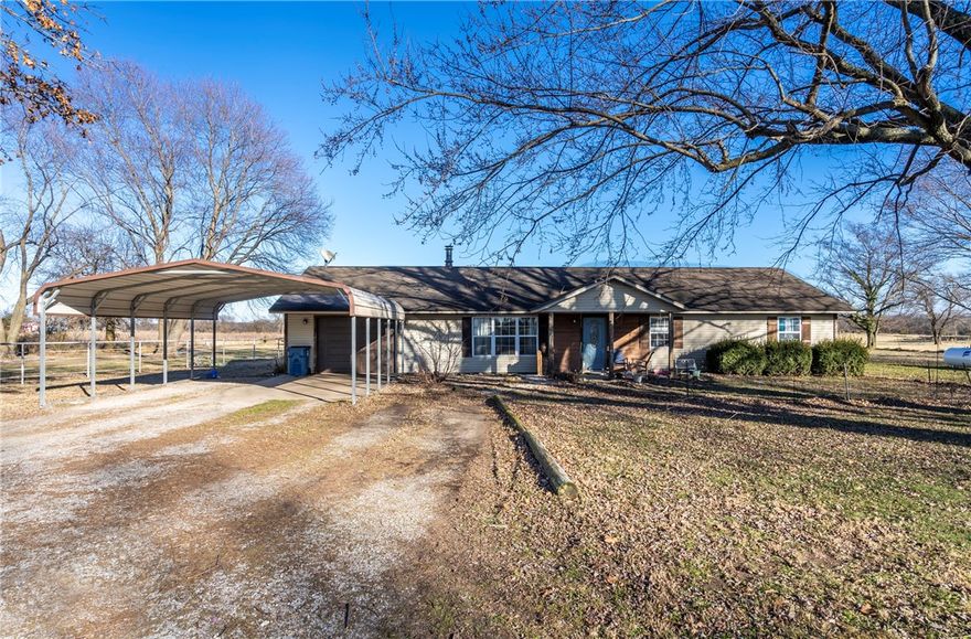 Check out this Charming Country Home on 5.77 acres with a 40x60 Barn, a lean to, horse stalls, fencing and room to roam! 3 Bed 2 Bath home with level acreage and a rural living lifestyle. The home offers a comfortable living space featuring a wood burning fireplace, solid wood kitchen cabinets, pantry, window over kitchen sink that looks out over the property, propane stove (new 2024), propane hot water heater (new 2025), and recent hvac updates include new air in 2025 & new heat in 2020. The land is fully fenced with wire & pipe fencing making it ideal for livestock or horses. Additional features include a one car garage, two car carport & a 2021 above ground pool that conveys. Has maintenance free vinyl siding, septic, Highfill City Water & trash service, along with Walmart delivery availability giving you the best of country living with modern convenience. If you’ve been searching for land, a barn and room to spread out, this one checks all the boxes!