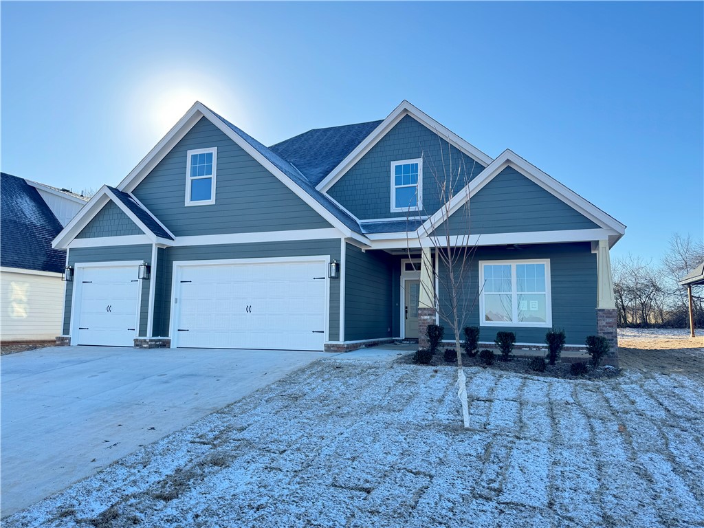 New construction home in desirable area in SW Rogers! It features 4 BR plus bonus room/3 baths/3 car garage. Downstairs has open concept in the living and kitchen area. Kitchen is equipped with gas cook top, built-in oven and microwave, large island, pantry, and eat-in dining. Primary is on main level with a spacious bath and closet. Bedroom 2 and full bathroom are downstairs as well. Upstairs has bedrooms 3-4, a full bath, and/or bonus room.