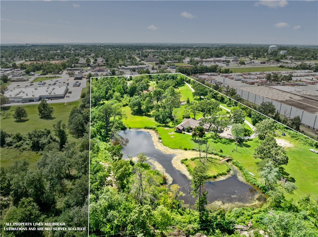 Over 13 Acres with direct access to 71 Business and New Hope Rd. Prime Commercial location near multiple large business districts. This property features 2 homes on site, one home operates as an Airbnb property and fronts private pond. The second home on site is undergoing current remodel, could be used as a secondary Airbnb, Office, or Retail. Fantastic land value in this location, zoned highway commercial with no covenant restrictions, this site has endless potential. Great location for storage buildings, office space, warehouse, and more. 400 Lilac property is 3,327SF and features a 3 Bed Home plus Office and 4 Bathrooms, the home has great features including large formal dining, stone fireplace, sunroom, and more. Currently used as an Airbnb property with wooded setting, private pond, and 10.86 AC. 711 Lilac features 2.49 AC, the 2,257 SF home is currently in renovation. Donāt miss out on this prime investment opportunity!