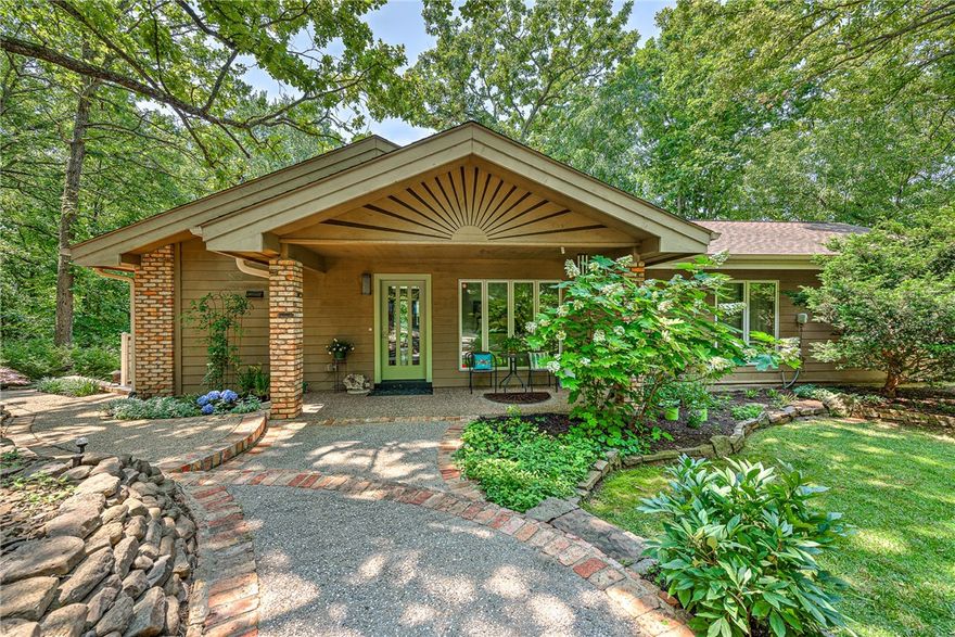 Indulge in the breathtaking scenery of 180ft of Beaver Lake waterfront from this custom-built home. Wake up to stunning lake views and enjoy the exclusive bonus of a community boat slip that lets you live the waterfront lifestyle to the fullest. With 3 bedrooms and 3 bathrooms, this professionally landscaped property also features a large deck, perfect for entertaining guests. You will find ample storage space in the oversized 2-car garage, along with a bonus workshop/utility shed underneath the deck. The upper level features the primary bedroom, additional bedroom, and office with built-in cabinetry. The large workroom/apartment on the walkout level is well-suited for an in-law or visiting couple, complete with full kitchen and its own separate entrance. Don't miss this chance to create a lifetime of cherished memories in this remarkable lakeside retreat!