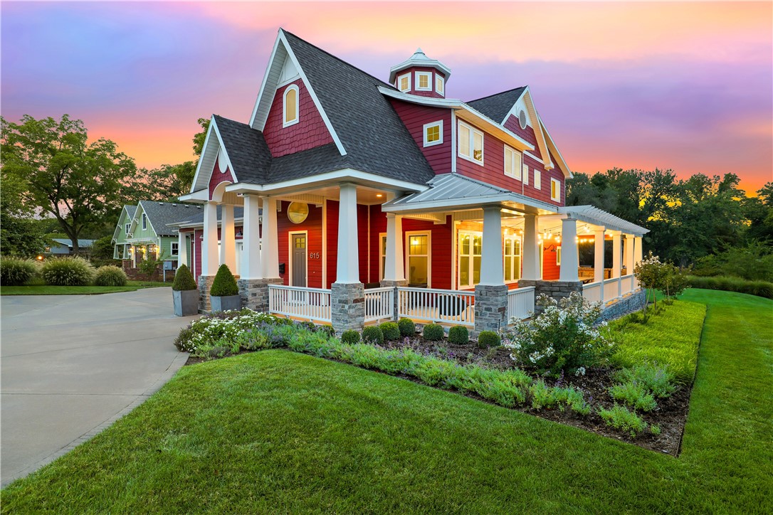 Welcome to an iconic Downtown Bentonville home that seamlessly blends modern amenities with classic craftsmanship. A prime location offers convenient access to the Downtown Square, trails, entertainment, and more. This one-owner, custom-built home boasts over 4,000 sq. ft. on nearly half an acre with a peaceful wrap-around porch. Step inside to be amazed by 20-foot ceilings paired with custom lighting fixtures and built-ins throughout the home. On the main level, you'll find an open-concept living area, the primary bedroom, and an office. The kitchen features open shelving, a walk-in pantry, quartz countertops, and a custom walnut island. The primary retreat includes two spacious closets and dual sinks. Upstairs, you will discover 3 bedrooms, a loft area, and a versatile flex space currently being used as a yoga studio. Additionally, there is an attached 3-car garage with an underground shelter. Experience Ozark modern living in this stunning home and live the Downtown Bentonville lifestyle to the fullest!