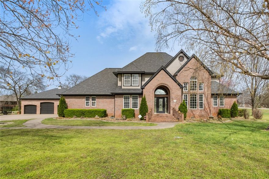 WOW, Talk about location. Offered on the market for the first time. This stunning property on a massive 1.83 acre lot in the heart of Rogers. Just steps away from the Razorback Greenway, Less than 5 minutes from the Promenade and the Amp. Lots of open space in the home with soaring ceilings, an amazing outdoor space with a pool, and 6 garage spaces. Homes in NWA don't come on the market like this very often, come see today.