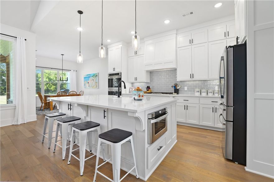 Modern farmhouse home on generous sized lot (approx. 2.42 AC) in one of East Fayetteville sought after subdivisions, Riverside Estates. This home offers an abundance of space for your growing family needs or for your new interests and hobbies as a retiree or empty nester. Each of the 5 bedrooms is accompanied with a full en suite bathroom (primary suite and 2 guest bedrooms on 1st level and 2 bedrooms on 2nd level one with entry through the private stairway in garage). Some of the many features included in this home are; wood flooring, vaulted ceilings w/exposed beams, dining room, office, quartz countertops, 2nd living space on 2nd level and butler's pantry. Home sits on bluff, adjacent to the white river. You will fall in love with the options provided to enjoy the outdoors including the covered sprawling front porch, large covered back patio and green grass space large enough to add a private swimming pool. In addition to the 3 car attached garage there is also a detached shop or garage.