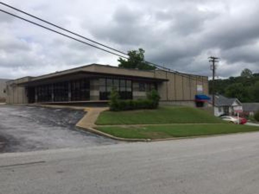 Excellent location on Main Street in Harrison, Arkansas. Near the hospital and downtown square. Well built building on 6/10 acre. Plenty of parking. Beautifully remodeled several years ago. Almost 10,000 sq ft on the main level and over 5000 sq ft in the basement. Offices, retail space and warehouse/storage space. 8 h/c units. 3 overhead doors.(3)half baths. One full bath. 2 hot water heaters.