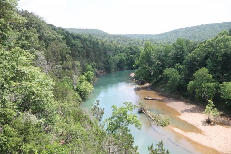 Introducing a rare opportunity to own one of the Ozark's most unique properties! Riverfront retreat, built by original owner Bill Wilson of Wilson Combat, sits on 33 prime acres in the Ozark Mountains of NWA. In this home, you will find the same quality, custom design & attention to detail that has made Bill Wilson an industry Elite in firearms. This sportsman's paradise appeals to hunters, gun enthusiasts, & anyone who enjoys nature & the outdoors. Stunning views overlooking The Kings River.