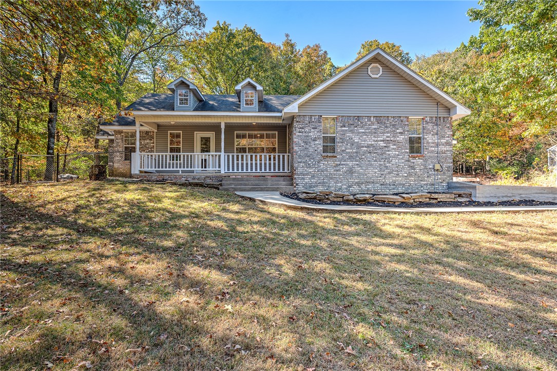 Welcome to your dream retreat! This stunning home is nestled on over 11-acres, offering the perfect blend of tranquility and modern living. Step inside to a spacious interior with an open-concept living area that features a wood burning fireplace with a beautiful stone surround. The master suite is a true sanctuary featuring dual vanities, a soaking tub, and a separate shower. Upgrades in 2022 include freshly painted walls and cabinets, popcorn ceiling removal, new can lighting, a full bathroom addition, Smartcore Luxury LVP wide plank flooring, Stainmaster Elite carpet, and a fully renovated garage that is now a bonus room. Outside, the expansive property offers endless possibilities including a spacious deck, fire pit and a 2,000 square foot shop. Enjoy the serenity of the property with a creek on site. This home offers privacy and convenience with I-49 only 17 minutes away. Donāt miss this rare opportunity to own a beautiful home on a sprawling piece of landāschedule your private tour today!