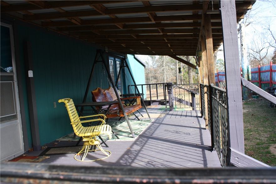 This 25.4 ac wooded land with a modest 3 Bd/1Ba cabin on county road 8001 is a perfect weekend get away for avid hunters.  2 car carport and also an RV cover, several outbuildings for storage.  Land boasts several springs with wet weather creek, caves to explore, several old logging roads, flat spots to build your forever home with beautiful views. 2 hunting stands in place with shooting lanes. Access to Bull Shoals lake 20 min to end of  MC 8001. Hunt deer, coon and turkey on this property.  Adjoining 10 acres, with electric and water also available to purchase. Cabin will qualify for VA.   Selling AS IS WHERE AS