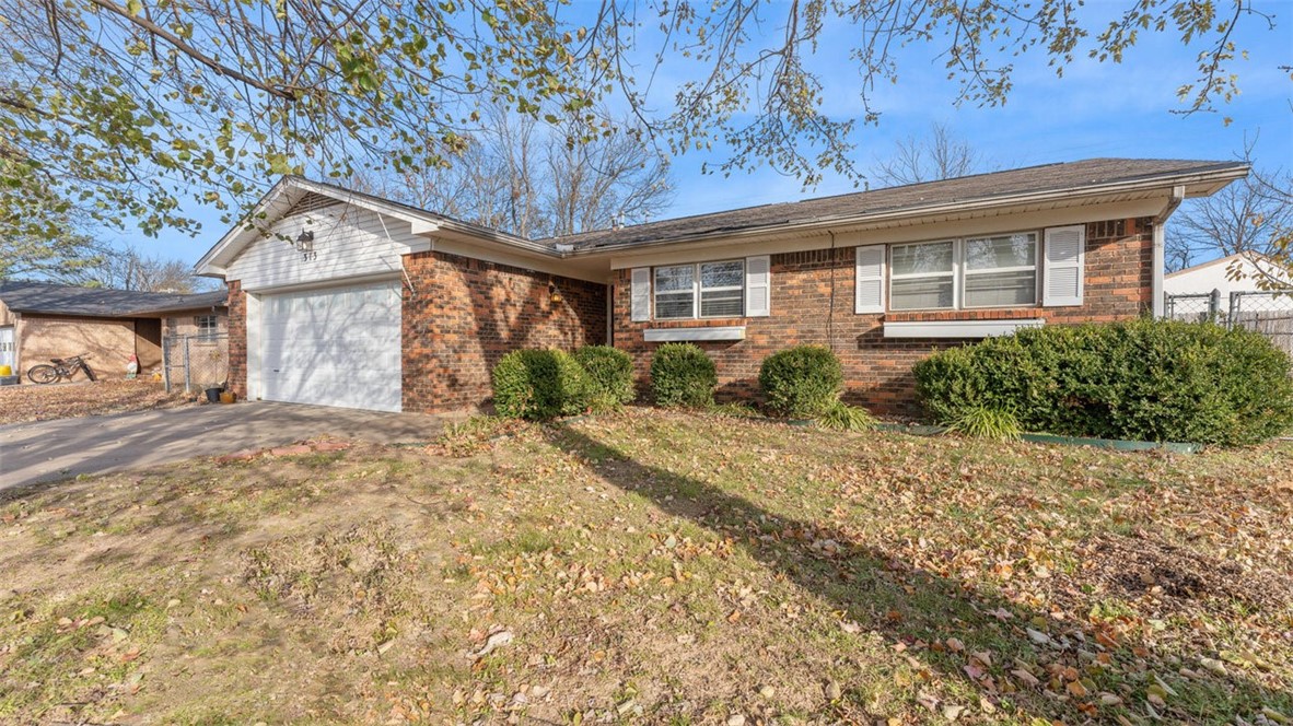 Charming 3 bedroom 2 bath home in an established neighborhood. 1,380 square feet of living space offering a cozy sunroom, a living room warmed by a wood stove, and a kitchen featuring white cabinets and a double oven. Some newer carpeting adds a fresh touch, while the private backyard is perfect for relaxation or entertaining. Enjoy convenience being just 2 blocks from Siloam Springs Middle School, five blocks from Cherokee Casino, and close to John Brown University. Ask Agent about plumbing estimate.
