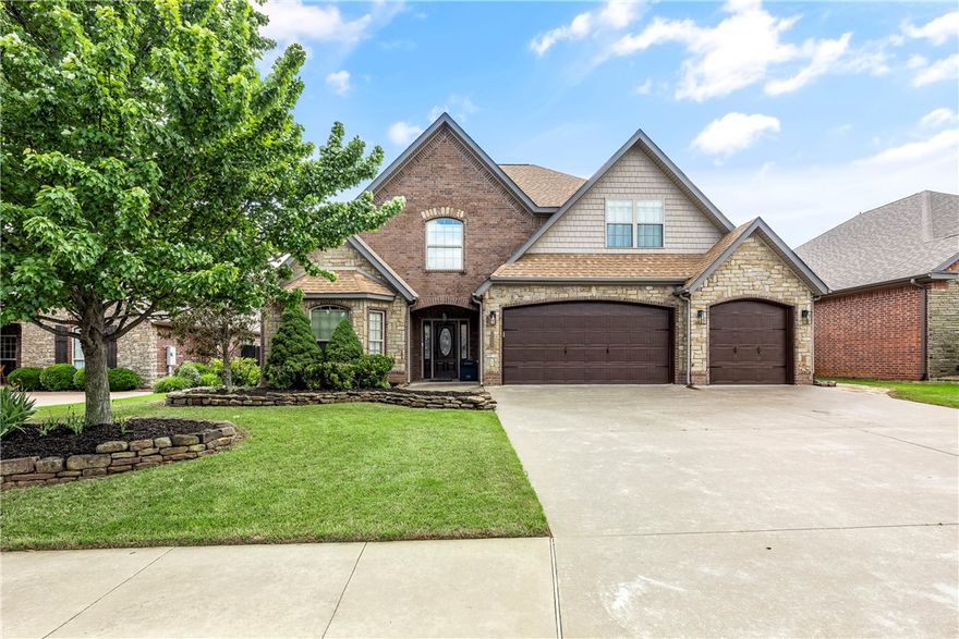 Welcome to your 4BD, 3BA dream home in Oxford Ridge!  The open floorplan & flowing layout are perfect for entertaining guests or simply enjoying time w/family. The covered back porch & extended flagstone patio create a lovely outdoor space for grilling & relaxing.  Spacious kitchen w/massive bar & gas cooktop seems like the heart of the home, ideal for gathering & making memories.  Living rm has soaring ceilings & corner FP.
The formal dining room could easily double as an office and offers flexibility.  The hardwood floors add warmth & elegance throughout the space.  The built-in cubbies & storage in the laundry room are practical touches that keep things organized.
Upstairs are 2 bedrooms, full bath, & bonus room w/wet bar, mini-fridge & microwave.  Walkable distance to Bentonville Community Center & schools adds convenience to daily life.  New roof ’23.
