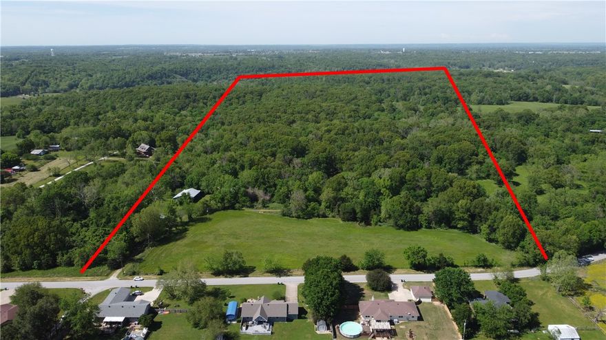 Forty-one beautifully wooded acres, located less than 10 miles from Bentonville Square and 10 minutes from downtown Rogers! The front 4-5 acres are cleared and ready to build your dream home! Walmart HQ, Rogers Promenade Mall, Slaughter Pen, and Crystal Bridges all so close! This land has amazing development potential. Walmart AMP, Promenade Mall and Crystal Bridges all within 10 minutes. This property has amazing development potential! It has both city water and electric, a new septic tank, 3 existing buildings, 2 ponds and more than 650 feet of road frontage.