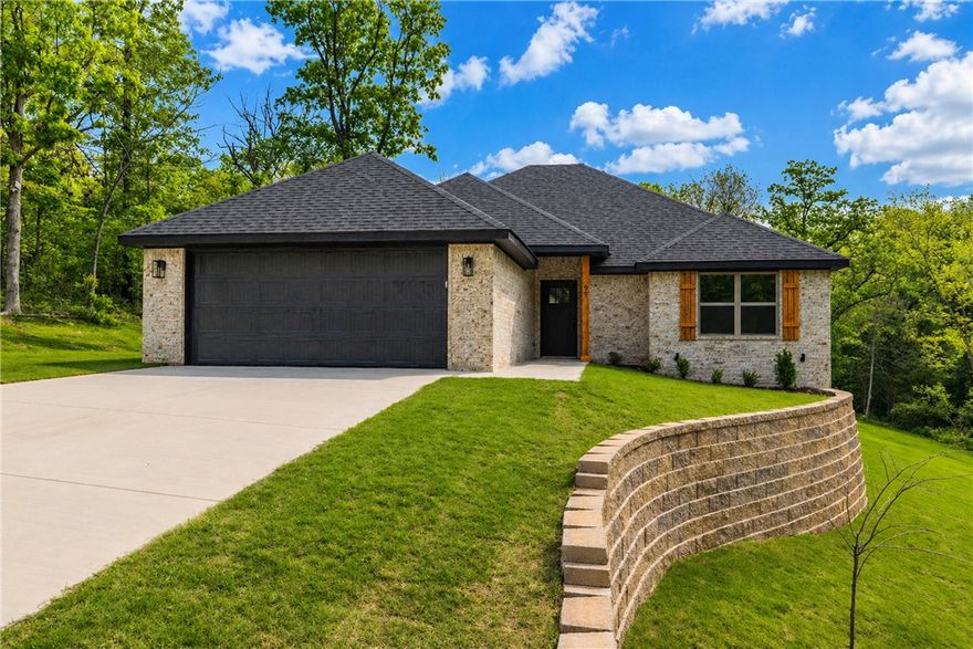New construction Bella Vista home! 3 bed/2 bath home on a large corner lot near The Highlands golf course, Branchwood Recreation Center, Lake Loch Lomond, with easy access to I-49 Bella Vista Bypass. Open concept/split bedroom floorplan boasts lots of natural light. High end finishes featuring hardwood floors in entry, living and master areas. Stainless steel appliances, gas log fireplace, granite/quartz countertops, walk-in pantry, and large island.  Spacious master suite features a large walk-in closet, double vanity, walk-in custom shower. Home is plumbed for a generator and covered deck for outside entertaining. Preferred lender offering $5,000 in closing costs paid.