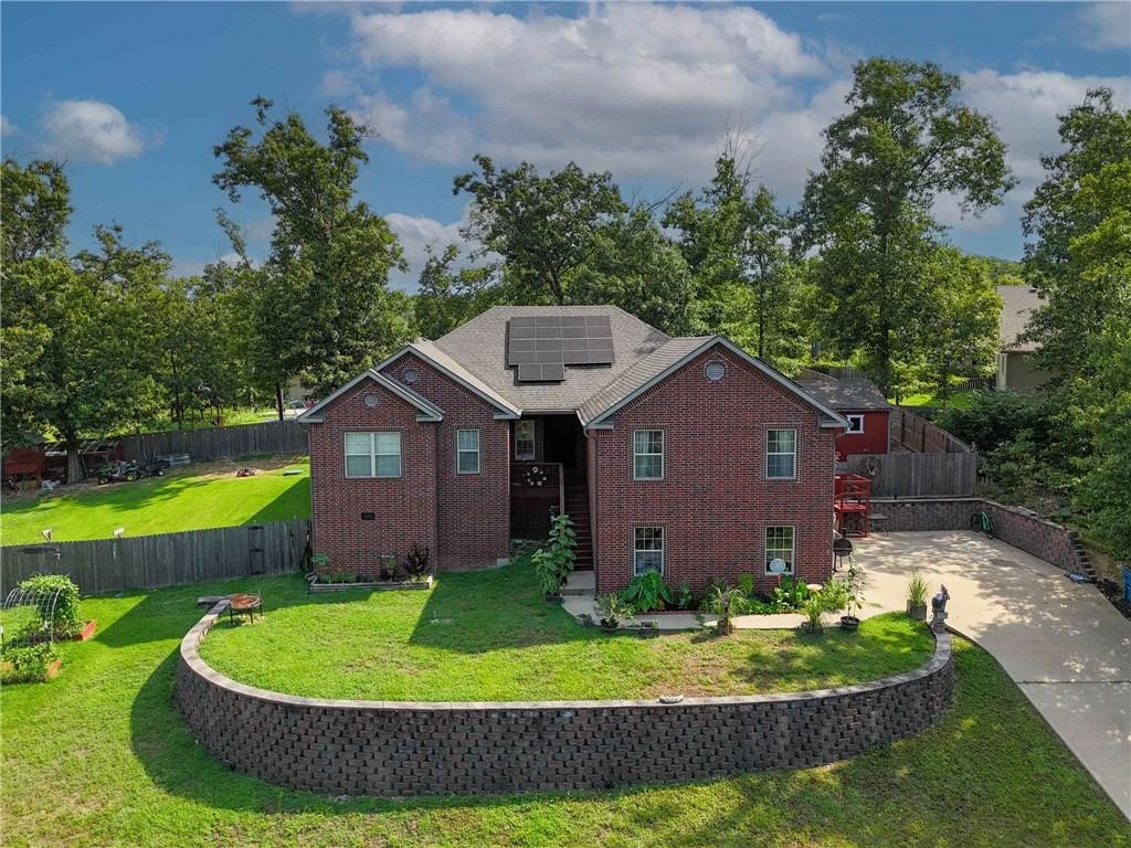 Set back for privacy, discover surprising space & outdoor potential in this Bella Vista home! You'll appreciate the incredibly level .38 acre backyard, a true highlight w/ chicken coop, greenhouse, 10x10 shed & garden area, as well as a raised garden. This 2,466 sf, 4BR, 2 12 bath home offers a desirable open floor plan, large kitchen island perfect for gatherings & a versatile bonus room over the garage with a half bath. Don't miss the huge storage potential in the tall crawlspace. Prewired for surround sound. Solar panels are paid off.
Conveniently located near I-49, trails and the BV Country Club