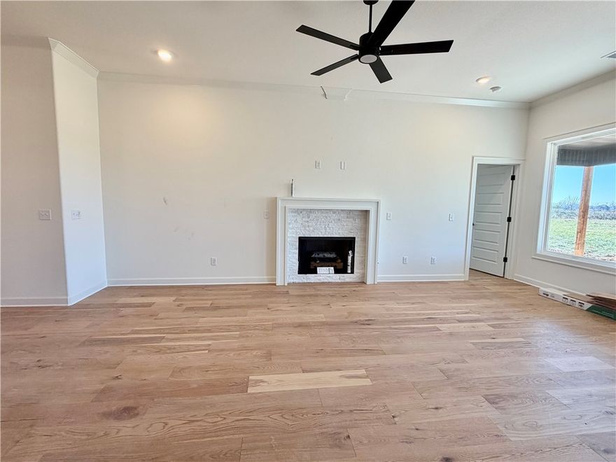 ** Limited time ** Contract in October and save an estimated $353 on monthly payment. Builder will provide a 5.5% 30 year fixed interest rate for qualified buyers with use of preferred lender. Preferred lender will pay up to an additional $5,000 towards buyers closing costs. OR bring your own lender and get 10K concessions from builder. Home also includes fence, blinds, & gutters at no additional cost. Completion estimated November 2025. Hillcrest in Cave Springs offers a rare blend of natural serenity and everyday convenience in NWA.  Introducing the 2600 Plan 5-bedroom, 3-bath home offers over 2,600 square feet of flexible, functional living space. Four bedrooms are located on the main level, including a private primary suite thoughtfully separated from the other rooms by the open-concept kitchen, dining, and living areas.The fifth bedroom is located upstairs with its own full bath. Stop by every Sunday 1-4 PM to learn about all the standard features included.