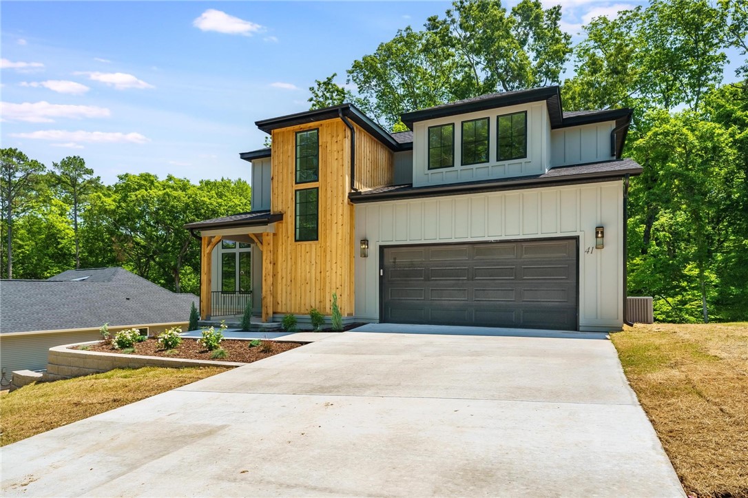 This 2 story just completed. Designer choices make this a standout. Open concept,vaulted,gas log f.p. in living room which has tall windows to enjoy the private,treed backyard. Natural wide plank flooring has been carried throughout. The kitchen features unique black mat finished granite counters with classy tile blacksplash. The eat-in area adjoins the 17x11 wood covered deck with iron railing. The primary baths up and downstairs both feature double sinks. Master bath also has a soaking tub as well as a walkin shower.Completely landscaped in a dead-end culdesac. The street is due to be paved by the city in June.