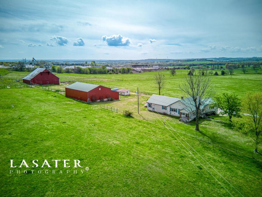 What a Fabulous Property! Just imagine getting to take in the Spectacular views of the beautiful Ozark Mountains, right from your own back yard!  Walkout basement home, with outbuildings, 60x40 Shop Building w/60x16 lean-to & stunning 60x80 Big Red barn, on 44 pristine acres.  There's a 1 car garage up, 1 covered parking area, and 2 car garage down. Home has 3 bedrooms, a Full bath,  a 3qtr bath, Sitting/dining area, spacious Kitchen, Large Living room & laundry on the main level. The basement has a large workshop area, substantial storage space, Wood furnace, well water reserve tank, H/A unit, & a bathroom. There are 2 different stairway accesses to the basement from the upper level. 1200 ft of hwy65 frontage gives easy access to shopping and dining in the area. Better hurry & grab this!