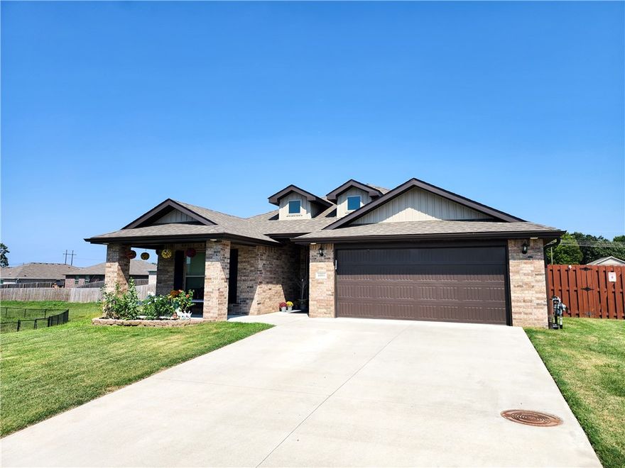 Discover comfort and convenience in this beautifully maintained home featuring four spacious bedrooms and a warm brick fireplace. The kitchen boasts granite counters and opens to a living area with durable wood-look tile for style and easy upkeep. Enjoy year-round comfort with a smart thermostat and peace of mind with a Ring doorbell. Step outside to a covered back porch overlooking a treated privacy fence, in-ground irrigation system, and buried gutter downspouts. A versatile 8x14 Tuff Shed offers extra storage or workspace. Perfectly blending charm and function, this home is ready for you to move in and make it your own!