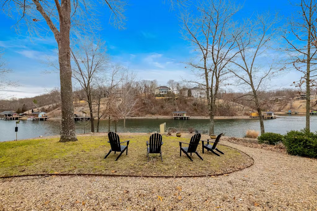 Lakefront Living with a gentle slope to the lake which features a boat dock, plus a small fishing dock.
Entertainment is written all over this home Everything has been totally updated for todayās market. New
roof in 2020, heat pumps in 2013 and 2017. Stainless steel appliances total kitchen remodel with new
cabinets. Skylight for more light. Sunroom off the kitchen, screened deck off the master bedroom, and
open decks between the sunroom and screened deck for your enjoyment. Home has been used as Airbnb for all of 2022 & 2023 and still is used as an airbnb (over $50k revenue in each of the last 2 years). Furnishings can go along with the house or be removed depending on the wish of the Buyer. Transferrable Home Warranty included.