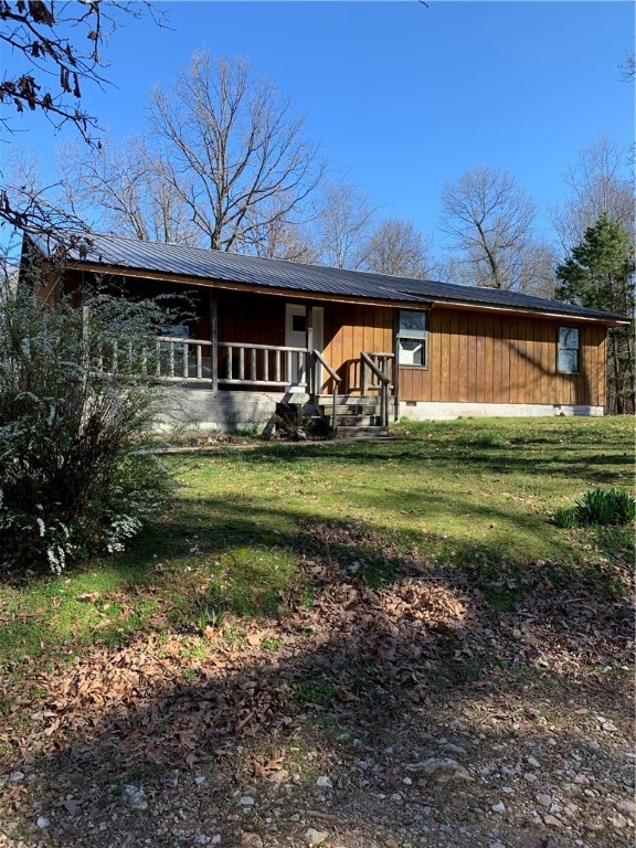 This listing has 5 lots (33, 34, 35, 36, and 37) included for approximately .39 acre. This home is on a dead end road and very secluded. Has beautiful views! It is located approximately one mile from the 30-acre Whitewater Park being built on the OK/AR border. Main feature will be 1200 foot long and 100 foot wide side channel with 8 drop features to provide responsible wave action for all skill levels of kayaking, surfing, strandup paddle boarding, tubing and rafting.