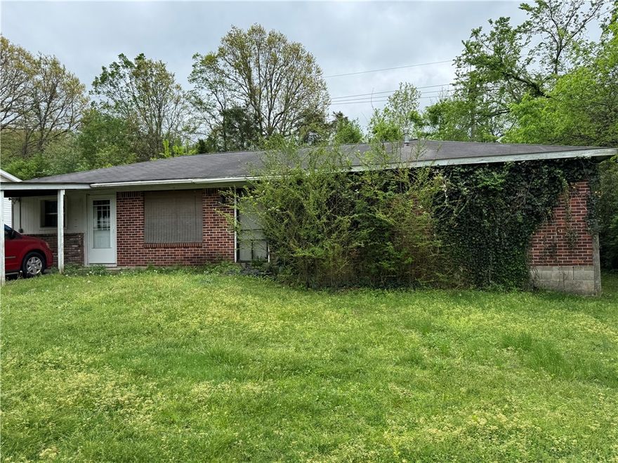 FIXER UPPER. Financing to be Cash or Conventional only as property is selling "AS IS, WHERE IS". This is an Estate sale. Needs proof of funds attached with offer. Allow 7 days for acceptance as Sellers have to get approval from lawyer. Allow 45 days for closing.  All offers need to state "Subject to Approval of Probate Court of Washington County Arkansas.  NO Property Disclosure as owner has deceased. Property is only one mile from University of Arkansas campus. & one-half mile from Razorback baseball field.