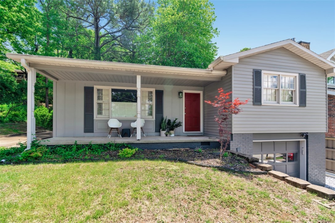 Welcome home to this charming home, nestled in the beautiful area of Mount Sequoyah. This home is in an unbeatable location, close to everything Fayetteville has to offer. You’ll love the natural light that comes in as you enter into the living room with the picturesque window. The first floor has three bedrooms with a Jack and Jill bathroom as well as a large updated kitchen that looks out to the beautiful backyard. The backyard features a lovely deck that looks out to a perfect spot for entertaining and enjoying the beautiful trees. This house also features a finished basement with a half bath as well as an unfinished area with ample storage. Newer roof and HVAC system. 1 car garage has 2 separate driveways. Don’t miss your chance to see this rare find in Fayetteville.